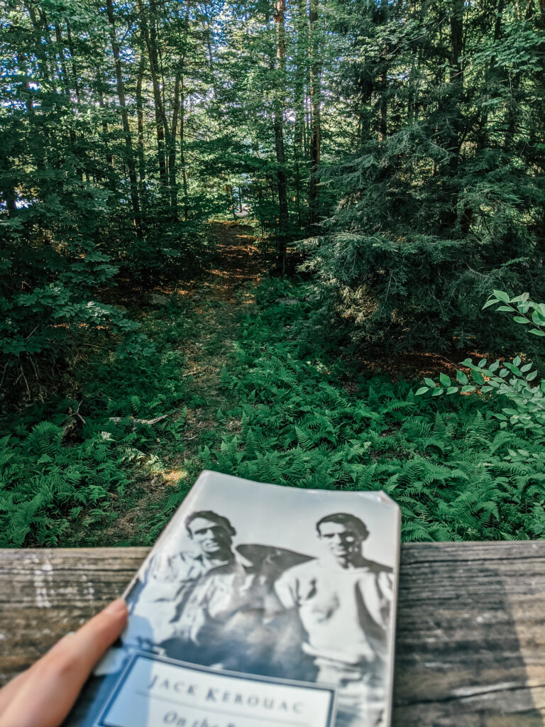 Image of book (Jack Kerouac's On The Road) in the Pocono Pines woods