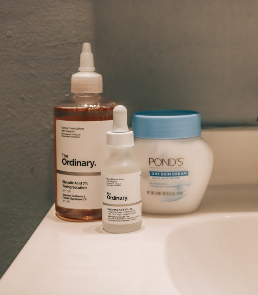 Cluster of winter skincare products: The Ordinary's Glycolic Acid 7% Toning Solution, The Ordinary Hylauronic Acid 2% with B5, and Pond's Dry Skin Cream