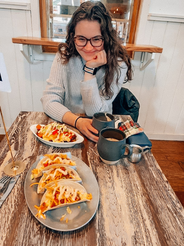 Photo of Moira, the blogger at Moira The Explorer, with breakfast at the Union Market, a women run cafe in the LBI Region